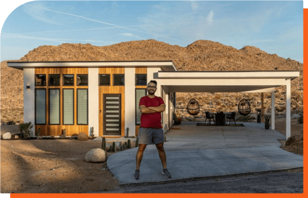 Image of Robert Abasolo standing in front of the Butterfly House in Joshua Tree, California